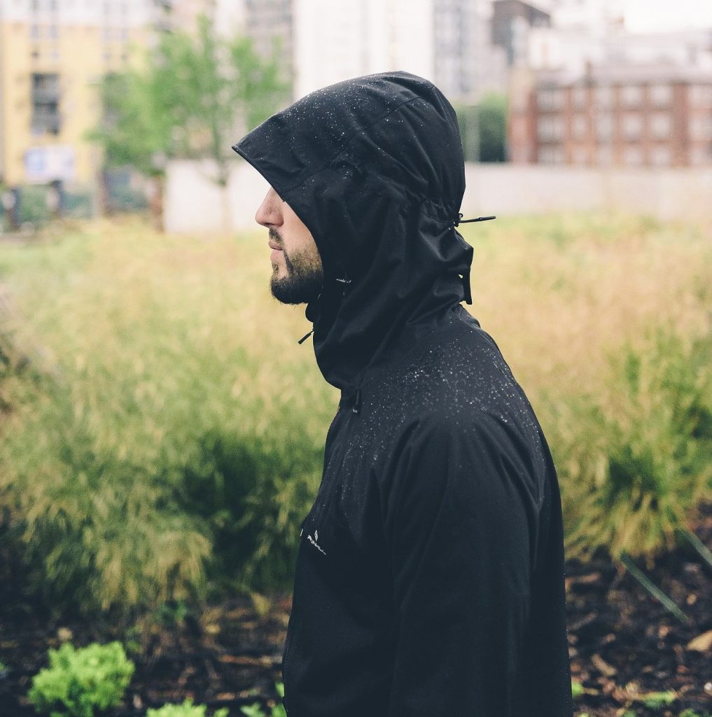 Men wearing a light rain jacket.
