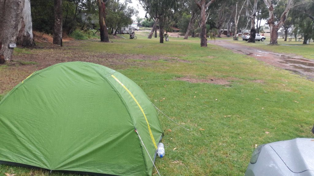 Green tent in Western Australia on a rainy day. 